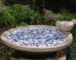 Aged ceramic bird bath