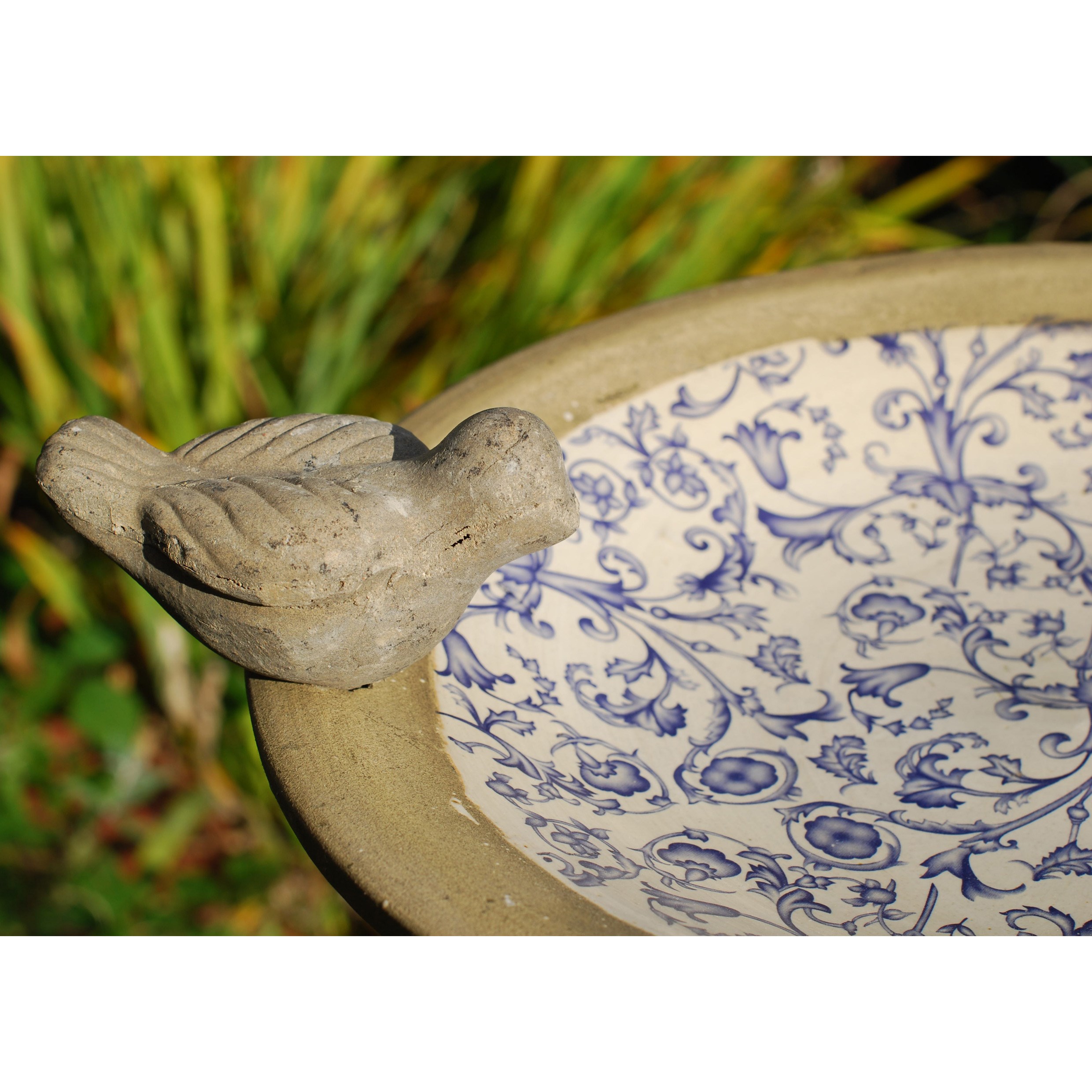 Aged ceramic bird bath