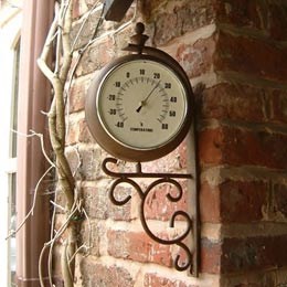 Antique rust outdoor clock and thermometer