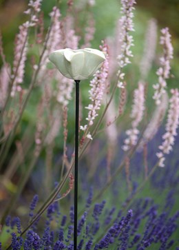 Glazed flower bird feeder on a pole