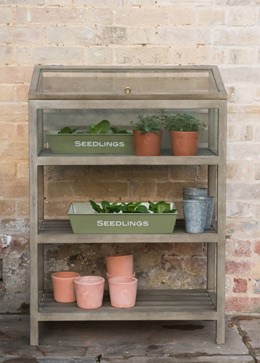 Weathered wood shelves with growing cabinet