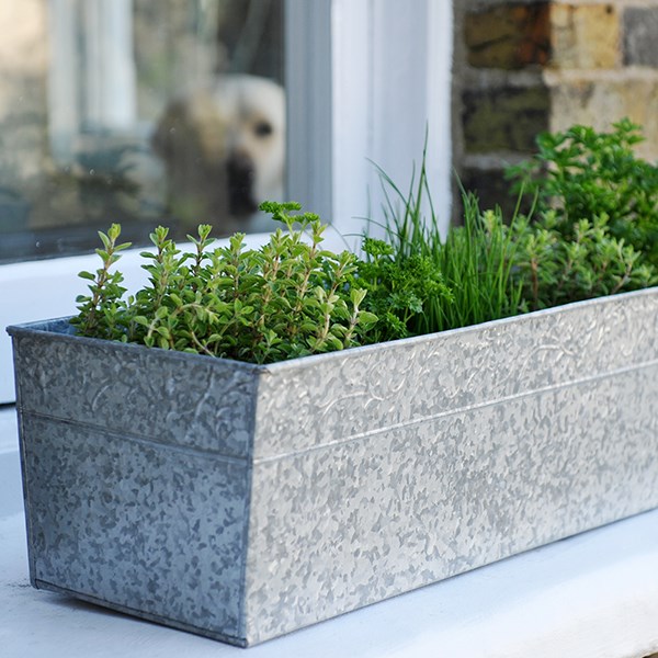 Embossed galvanised metal window trough