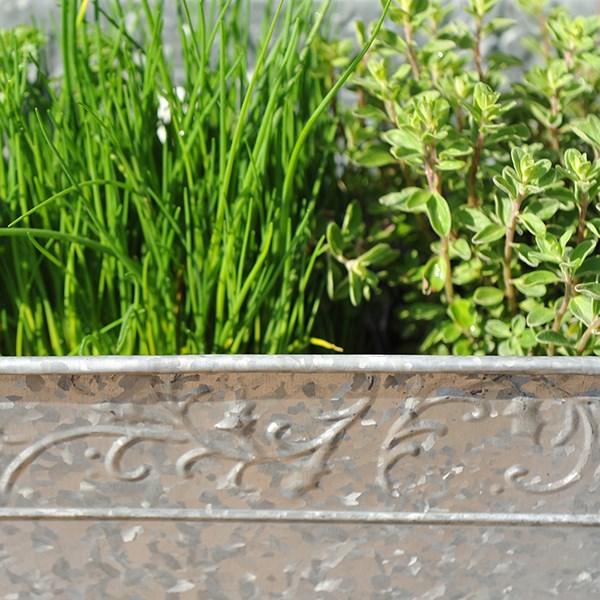 Embossed galvanised metal window trough