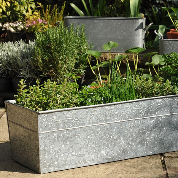 Embossed galvanised metal window trough