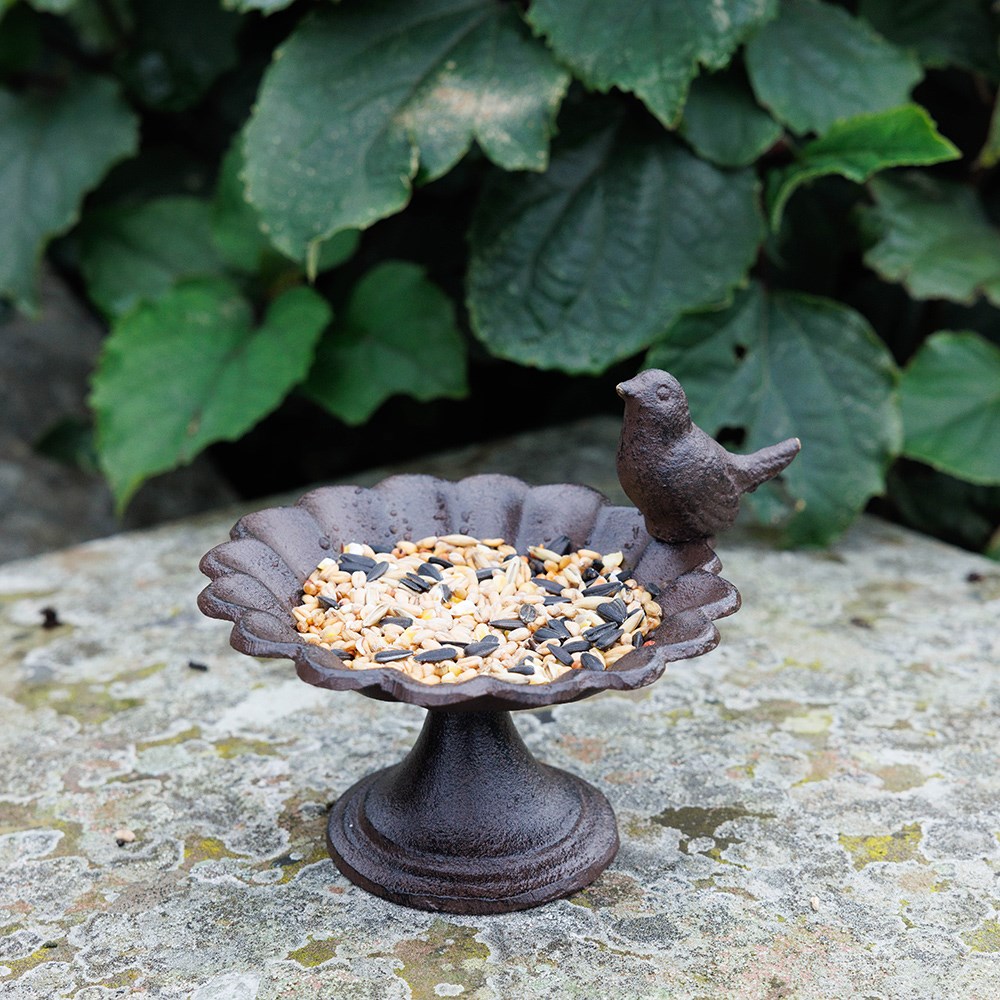 Cast iron bird feeder with bird