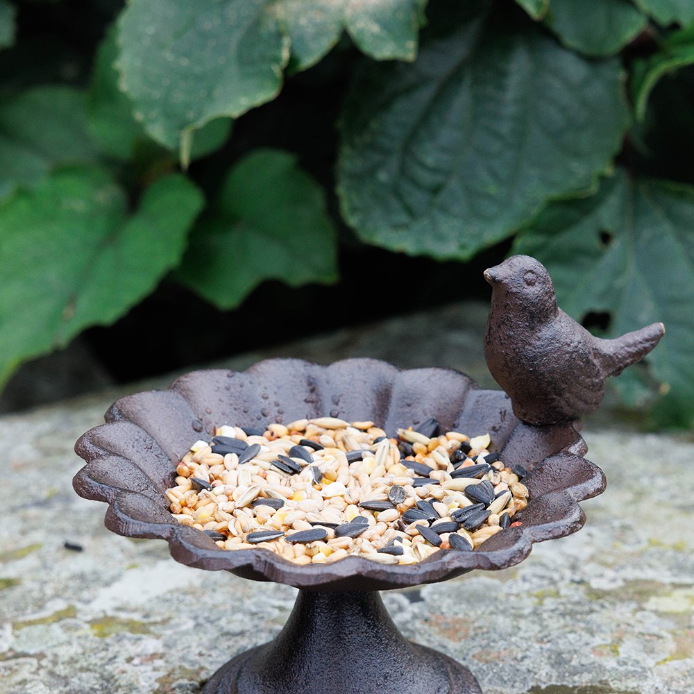 Cast iron bird feeder with bird