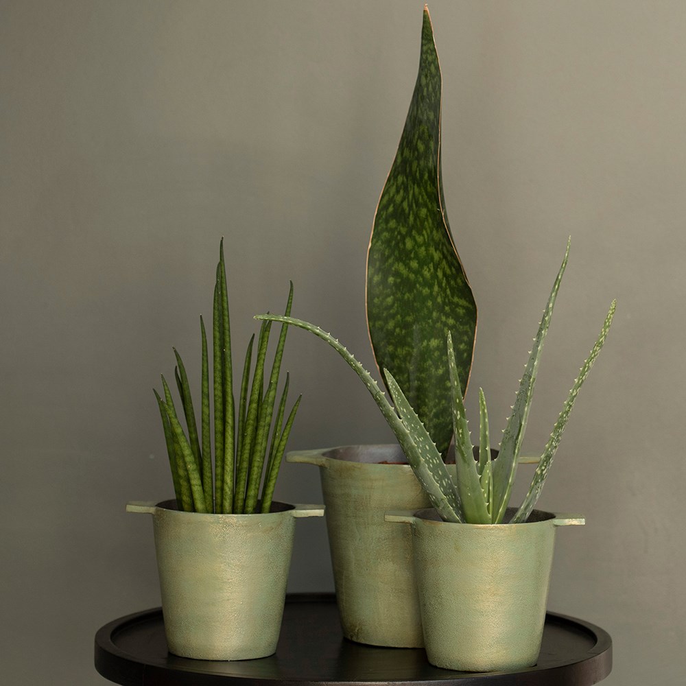 Cast aluminium pot cover with verdigris patina