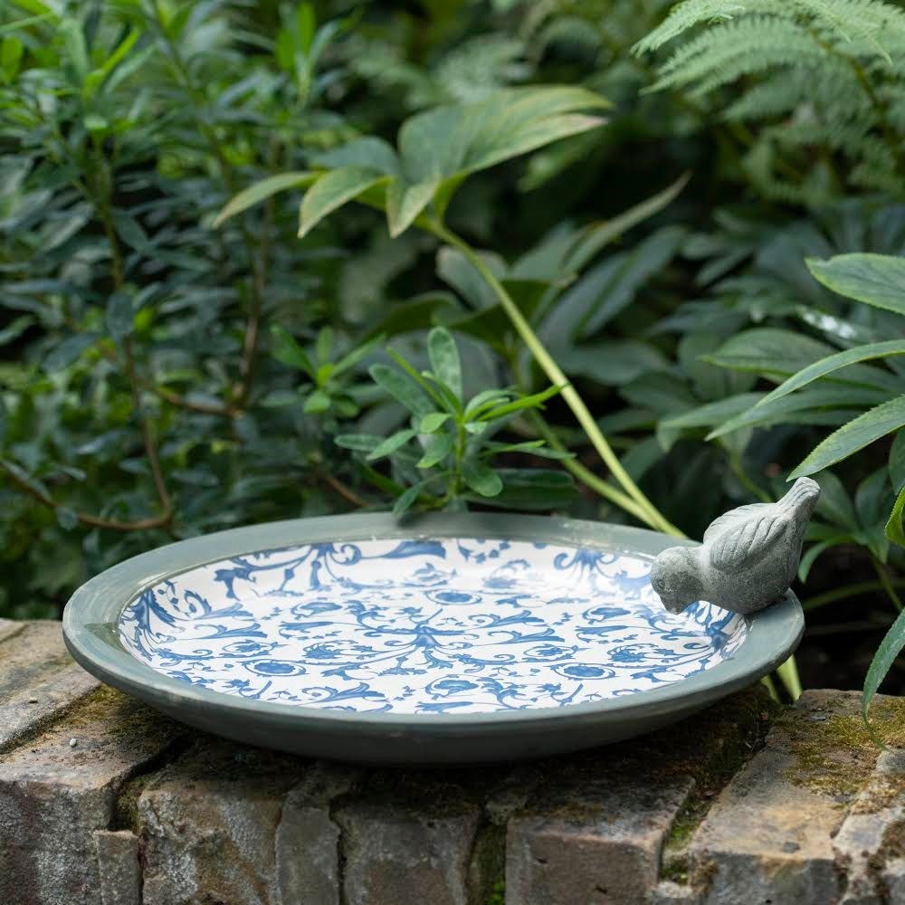 Aged ceramic bird bath
