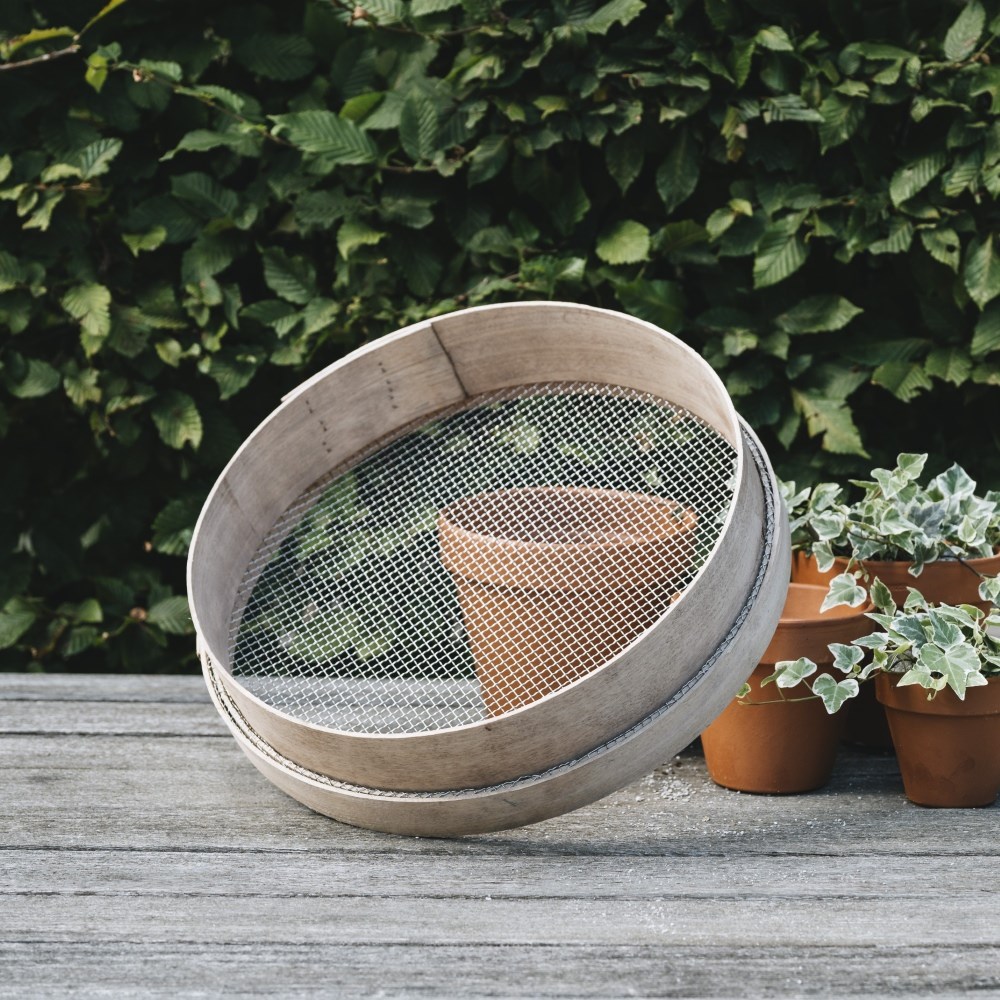 Traditional wooden garden riddle