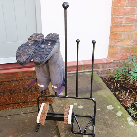Boot store with cleaning brush and boot jack