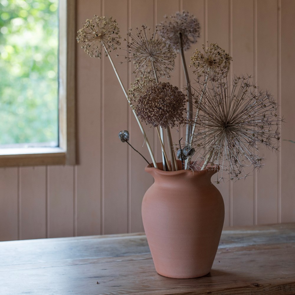 Terracotta ruffle vase with glazed interior