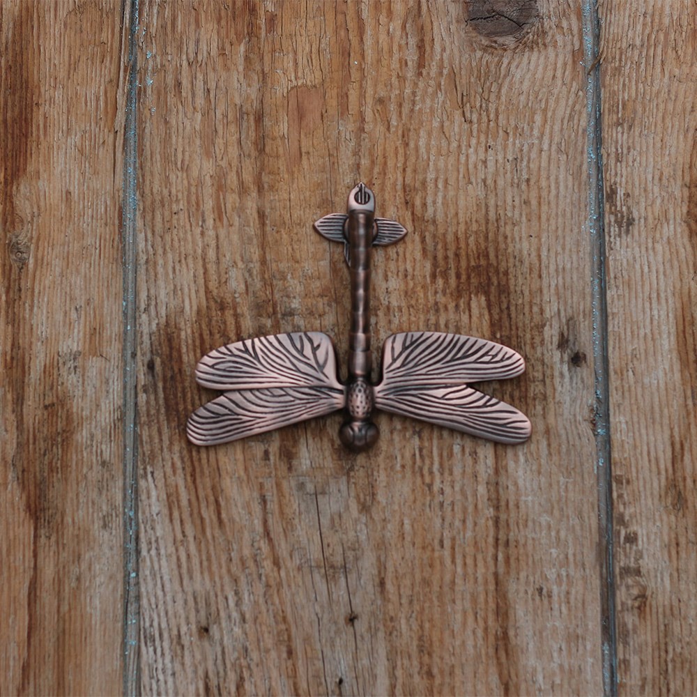 Aged bronze dragonfly door knocker