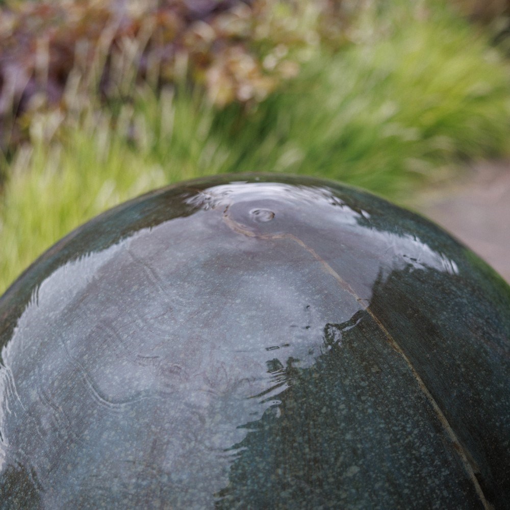 Large stone finish ball water feature