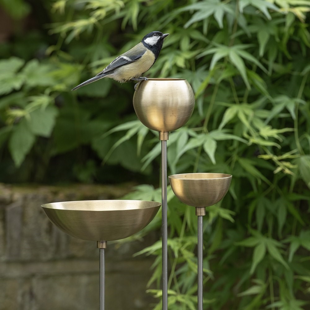 Brass bowl on stainless steel stake