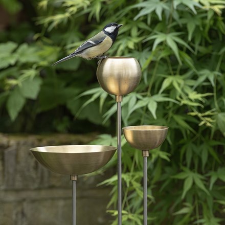 Brass bowl on stainless steel stake