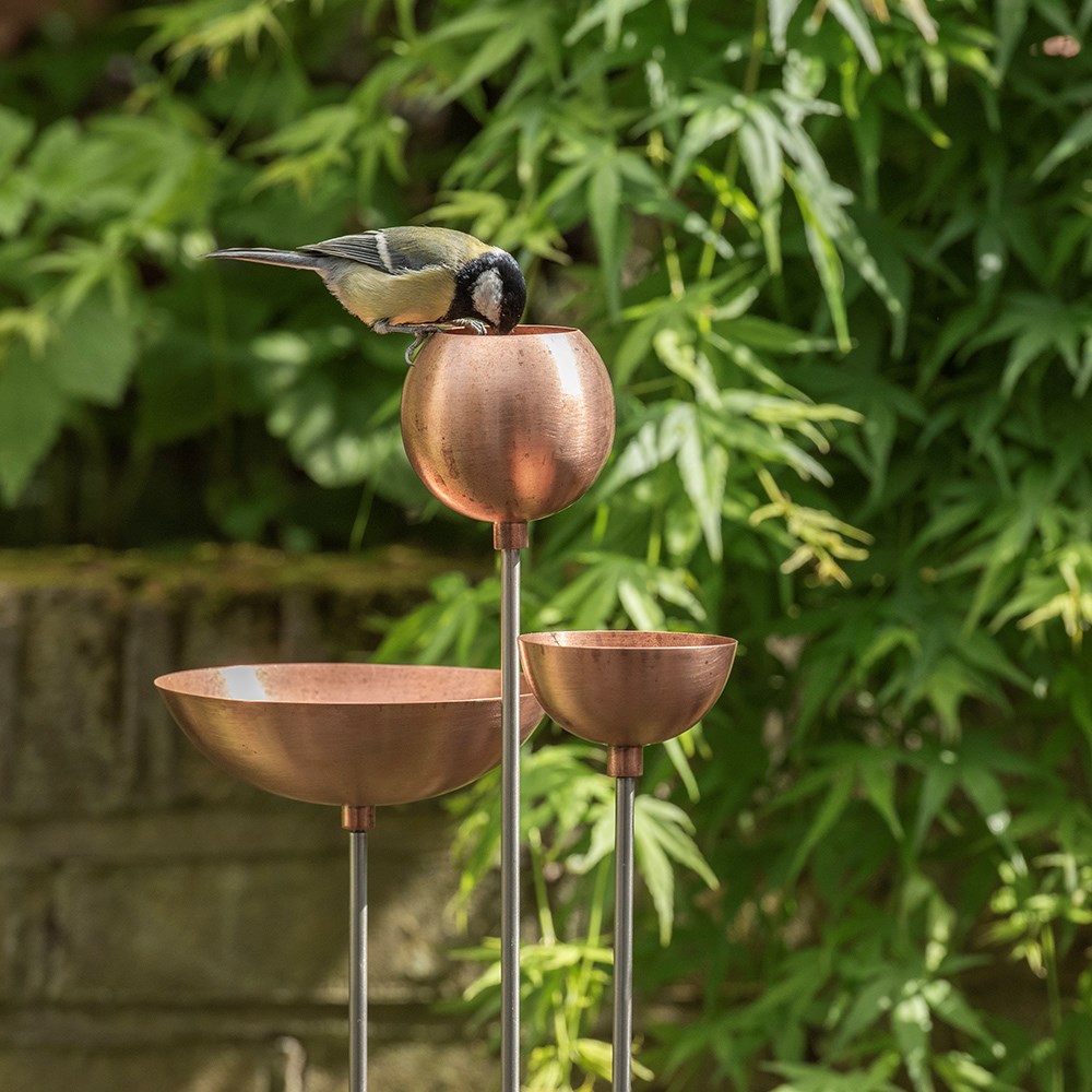 Copper bowl on stainless steel stake