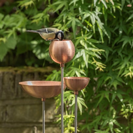 Copper bowl on stainless steel stake