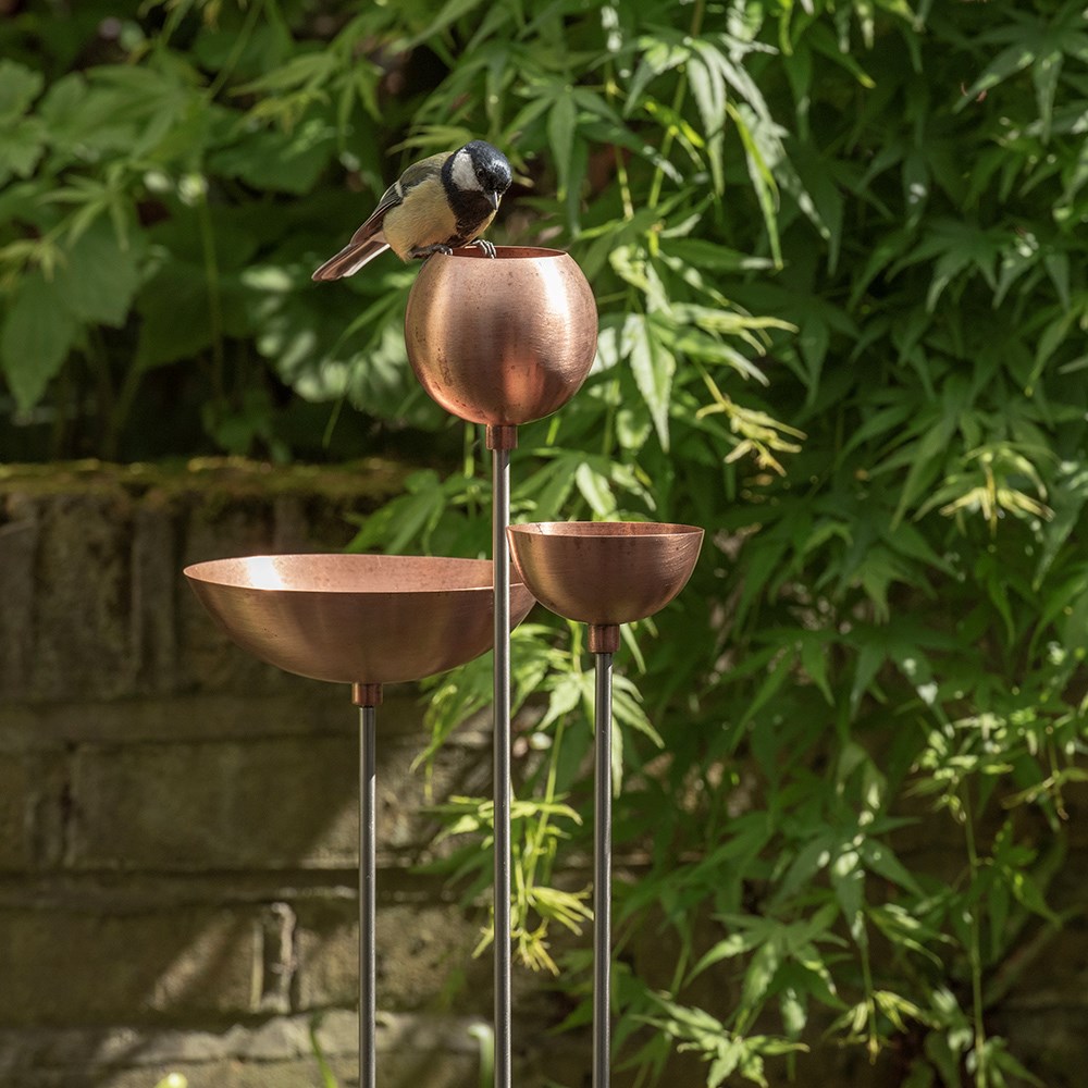 Copper bowl on stainless steel stake