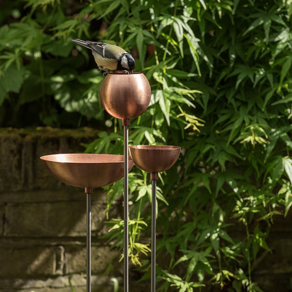 Copper bowl on stainless steel stake