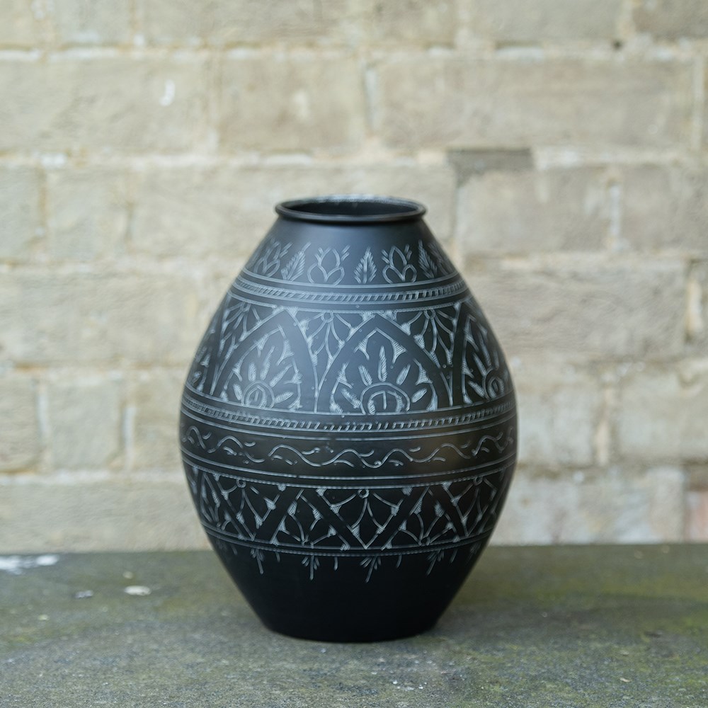 Traditionally etched black vase 