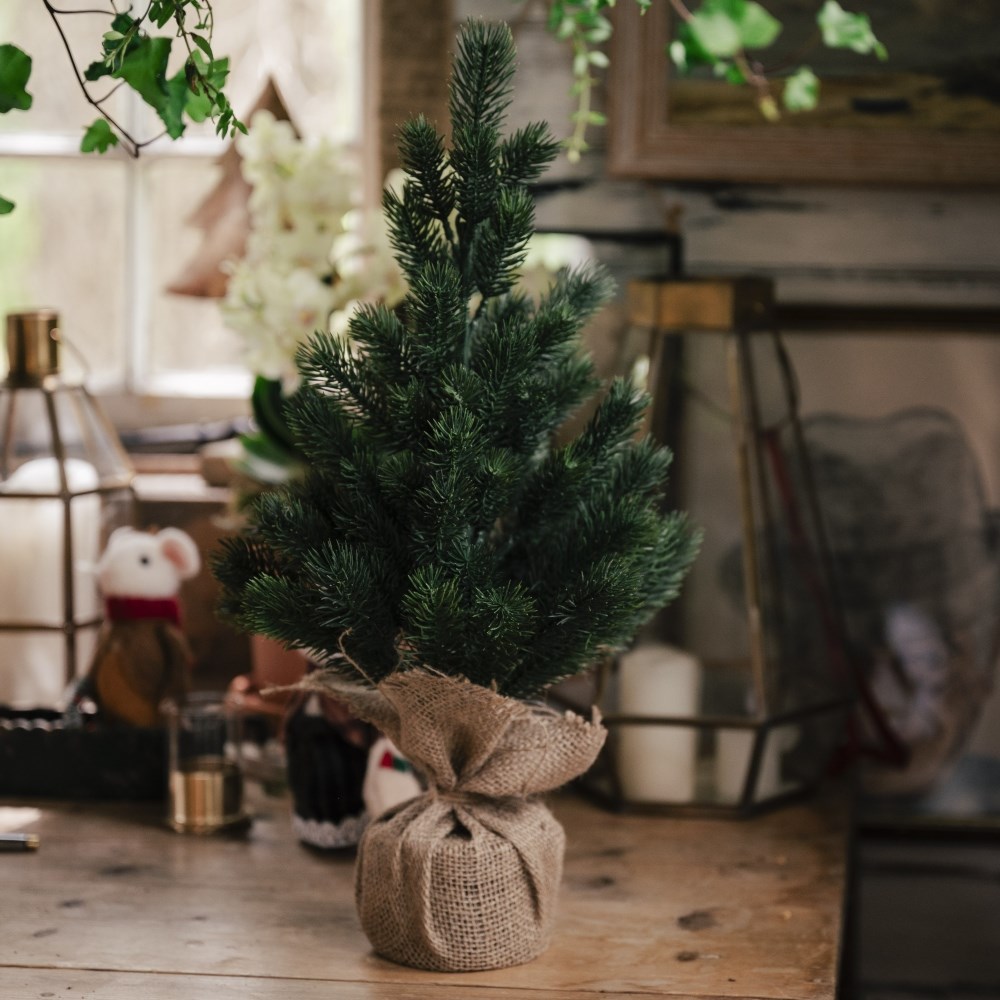 Faux mini Christmas tree with jute pot