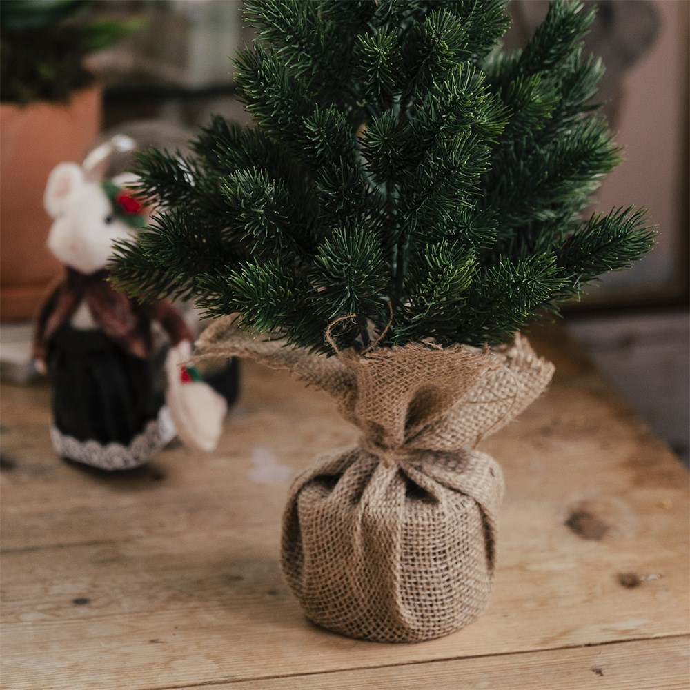 Faux mini Christmas tree with jute pot
