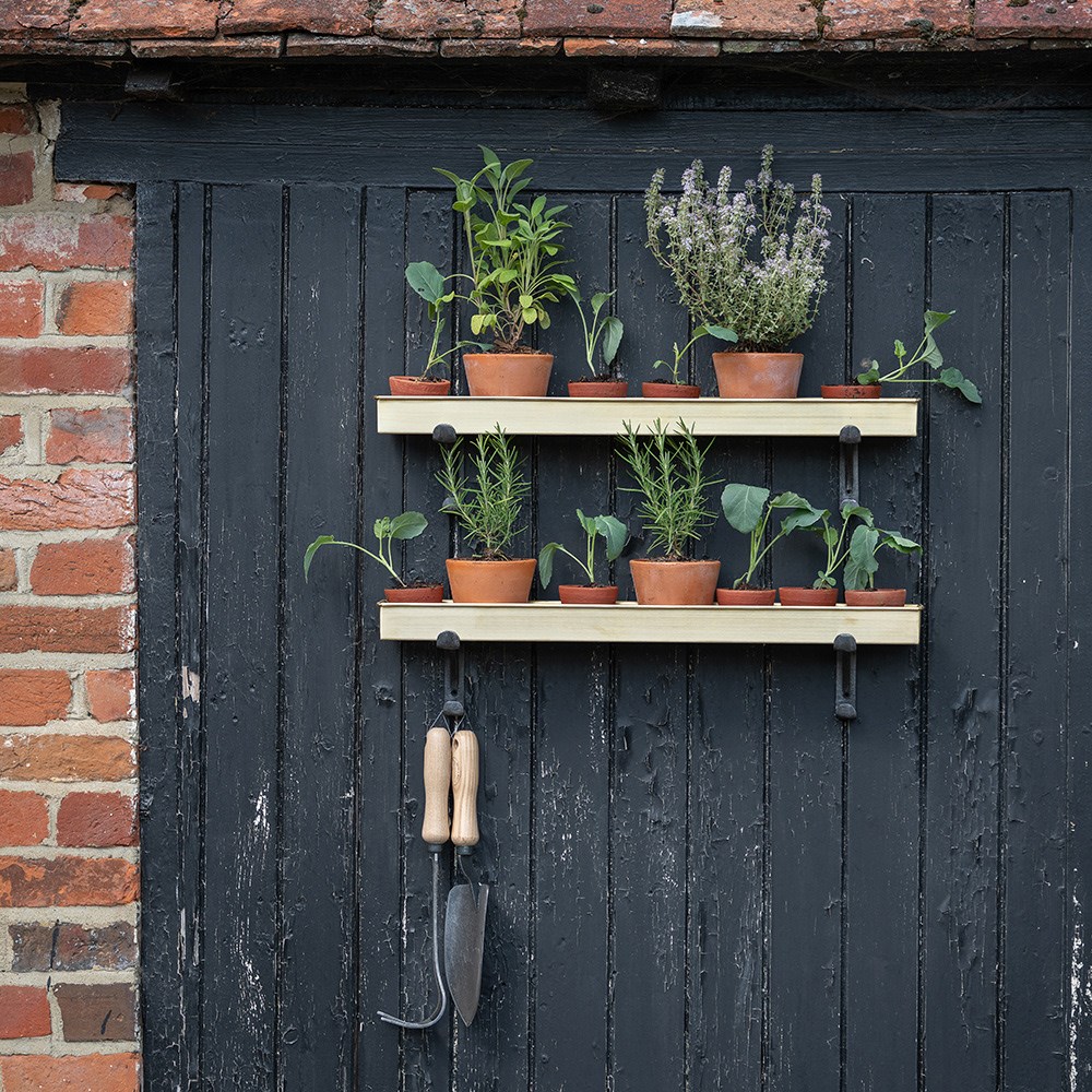 Brushed brass tray with wall brackets