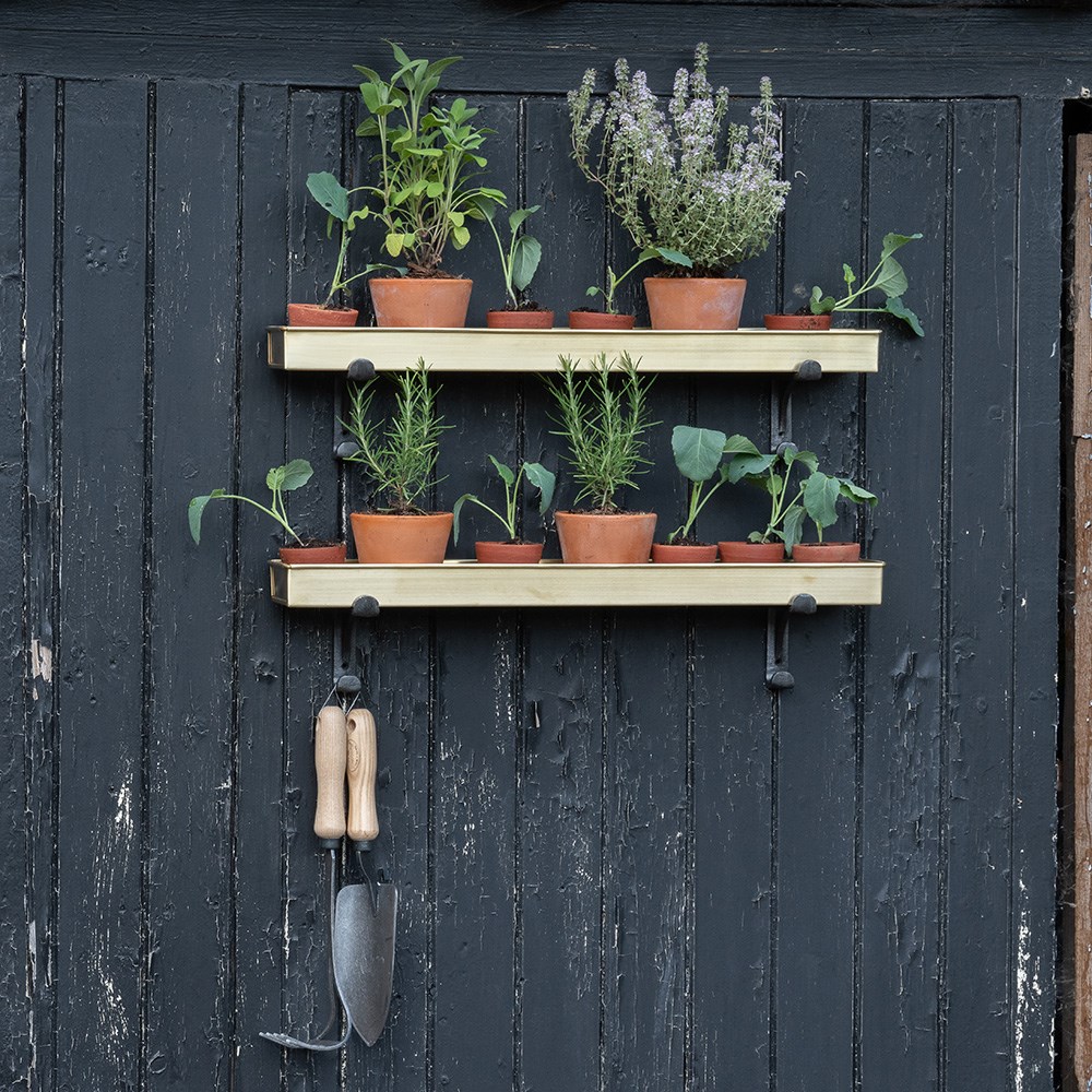 Brushed brass tray with wall brackets