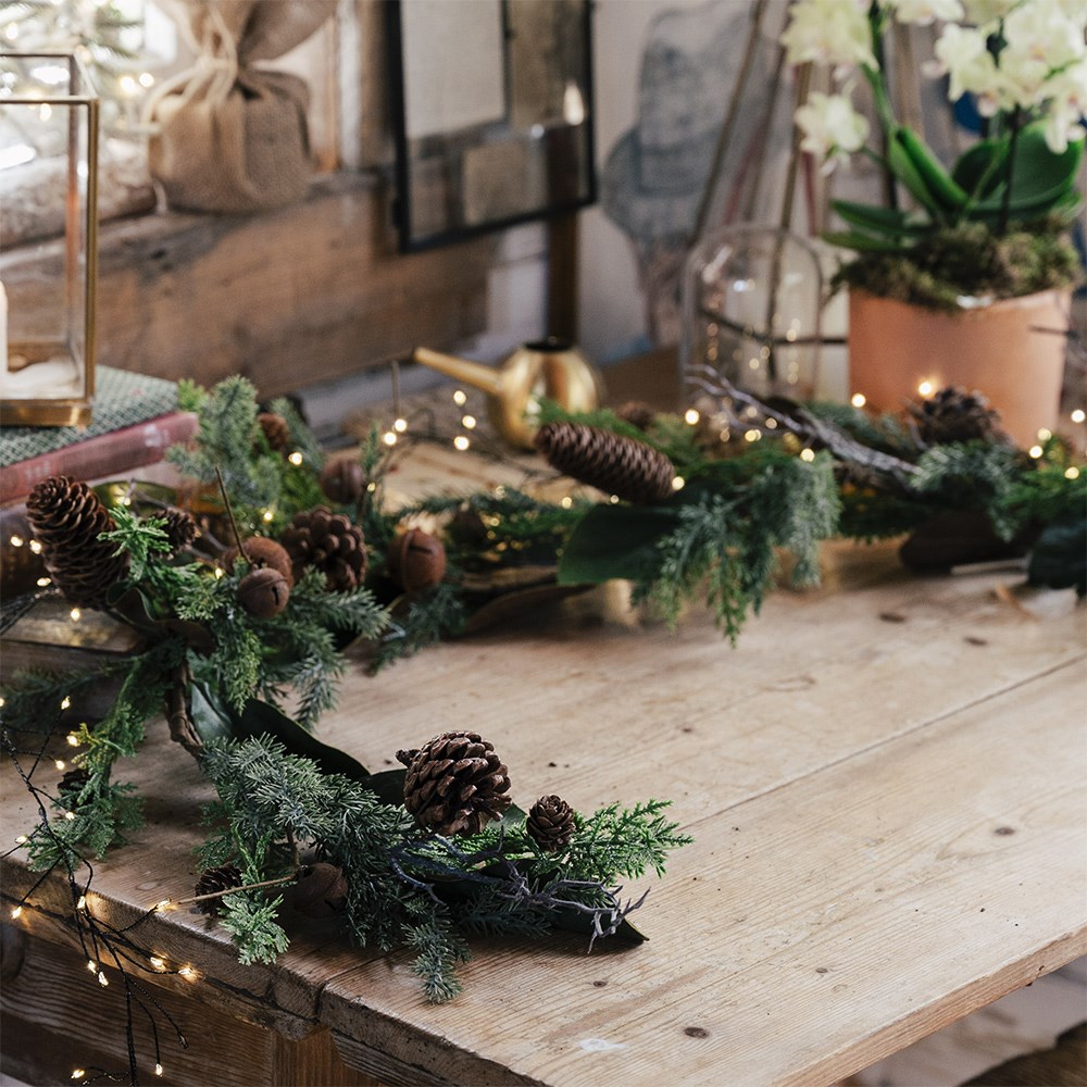 Green garland with rusty bells