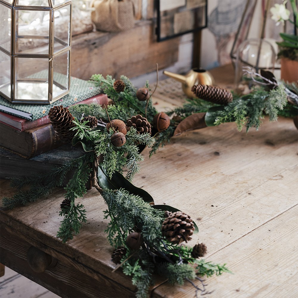 Green garland with rusty bells